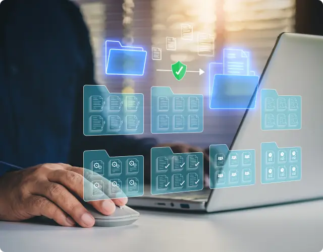 Person using a laptop with digital file folder icons and a green verification checkmark, representing secure document management within regulatory compliance software